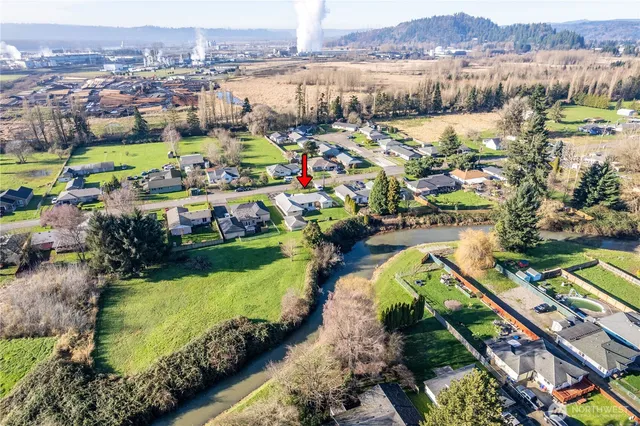 an aerial view of a houses with a lake view