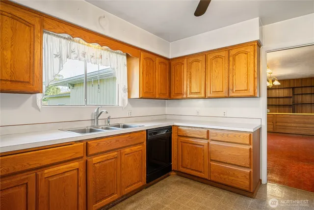 a kitchen with sink cabinets and window