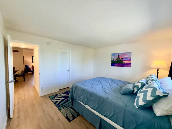a bedroom with bed and a view of bedroom