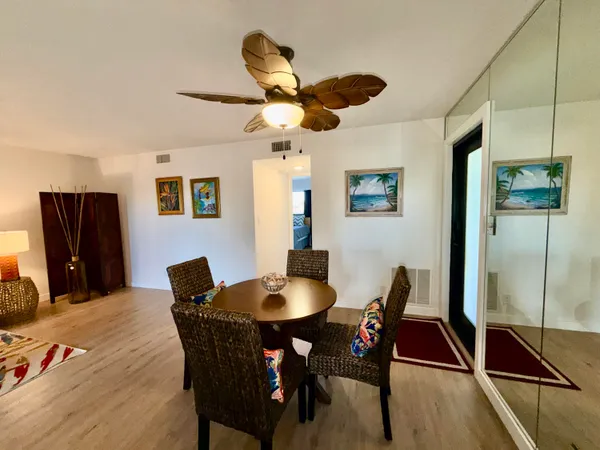a dining room with furniture and window