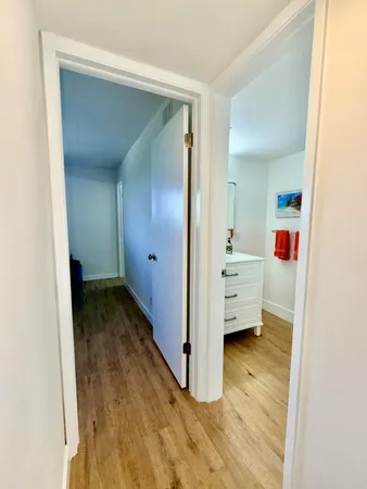 a view of a hallway with a room