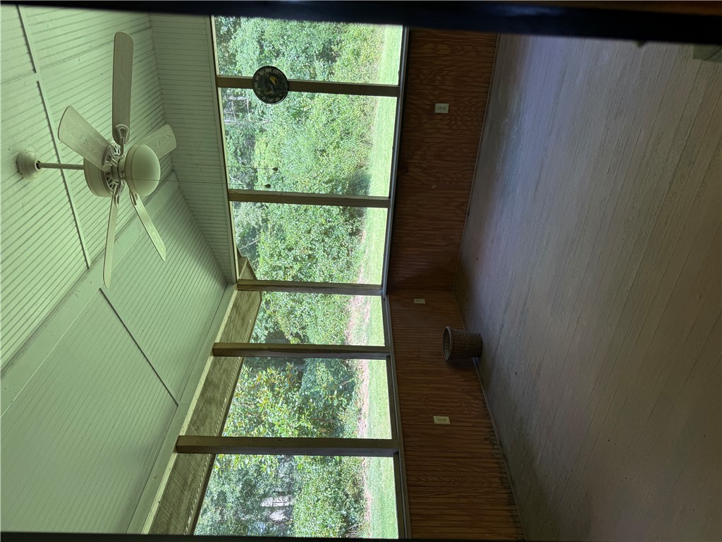 407 Seawright Drive Pendleton, SC 29670 - Photo 28 of 29 Wood paneled walls and a vaulted ceiling frame views of the surrounding greenery.