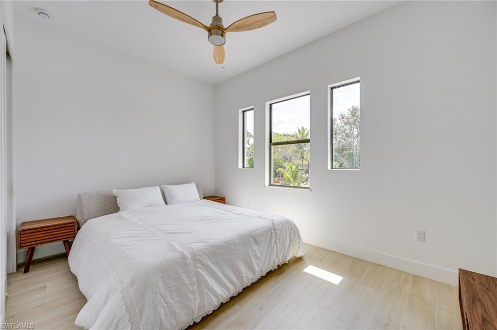 3400 Canal Street Naples, FL 34112 - Photo 22 of 34 a bedroom with a bed and a window