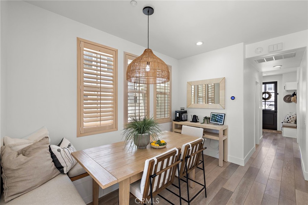 7 Bluewing Lane Ladera Ranch, CA 92694 - Photo 11 of 55 a view of a dining room with furniture window and wooden floor