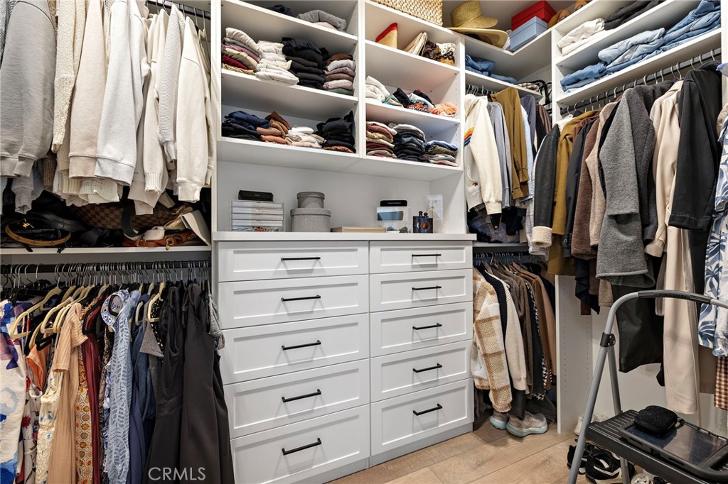7 Bluewing Lane Ladera Ranch, CA 92694 - Photo 23 of 55 a view of walk in closet with clothes and shoes