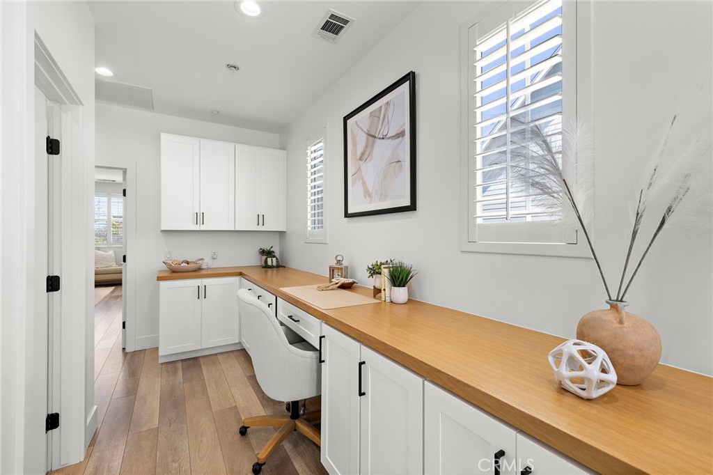 7 Bluewing Lane Ladera Ranch, CA 92694 - Photo 30 of 55 a view of a kitchen with a sink and wooden floor