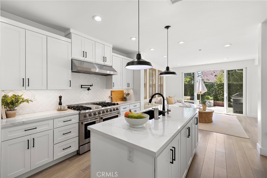 7 Bluewing Lane Ladera Ranch, CA 92694 - Photo 7 of 55 a kitchen with a sink a stove and cabinets