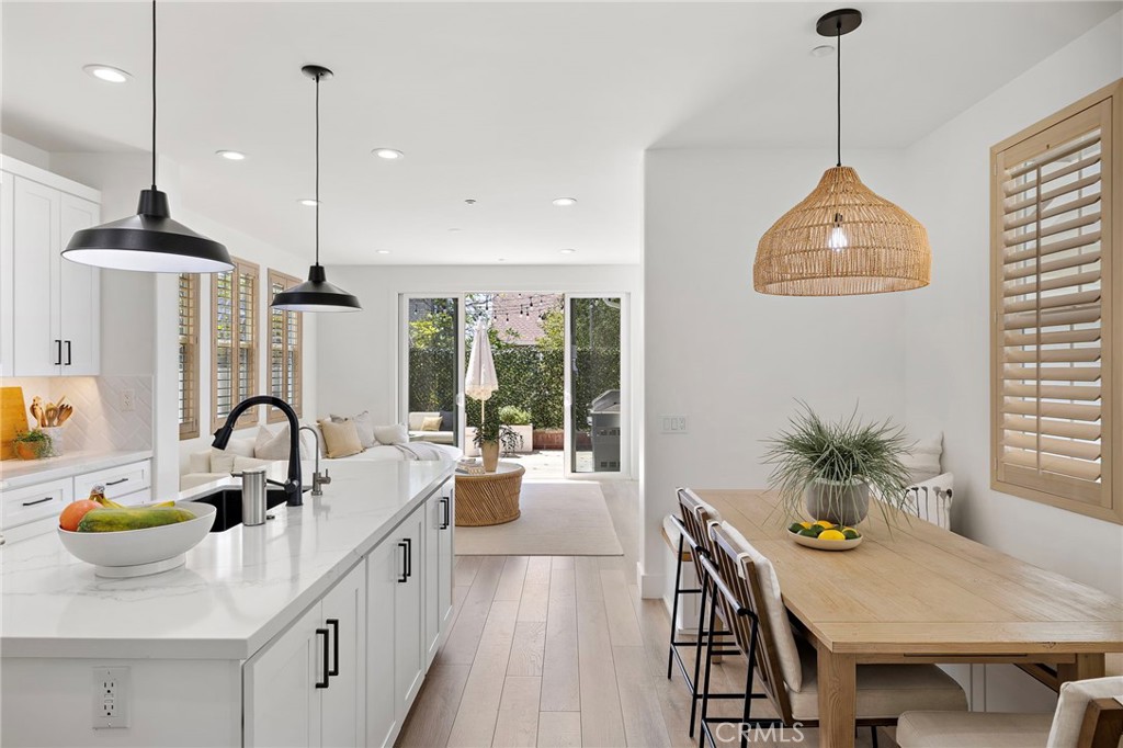 7 Bluewing Lane Ladera Ranch, CA 92694 - Photo 8 of 55 a kitchen with dining table and a sink