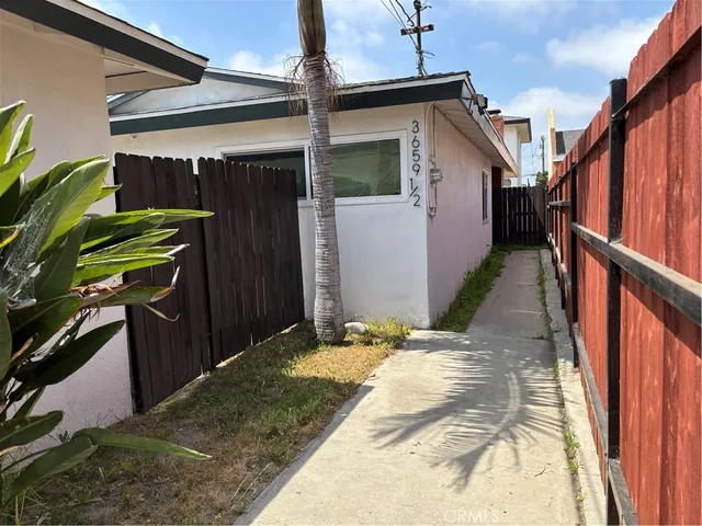 a view of a house with wooden walls
