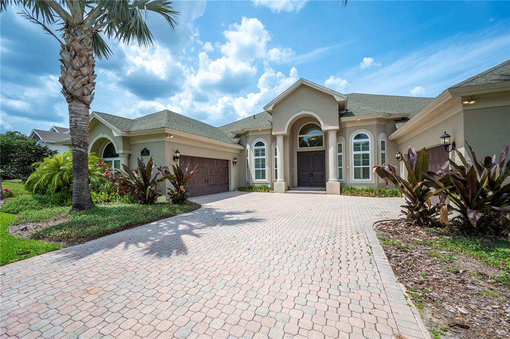 715 Hanover Court Lakeland, FL 33813 - Photo 1 of 1 a view of a house with a yard and potted plants