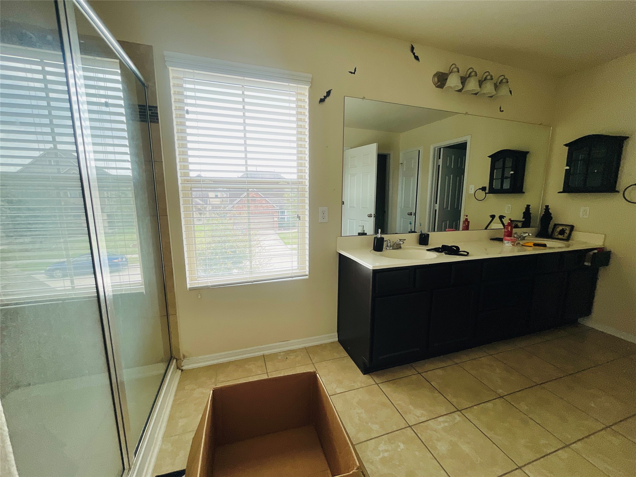 29311 Nectar Bloom Court Spring, TX 77386 - Photo 11 of 15 a bathroom with a sink a mirror and a bathtub