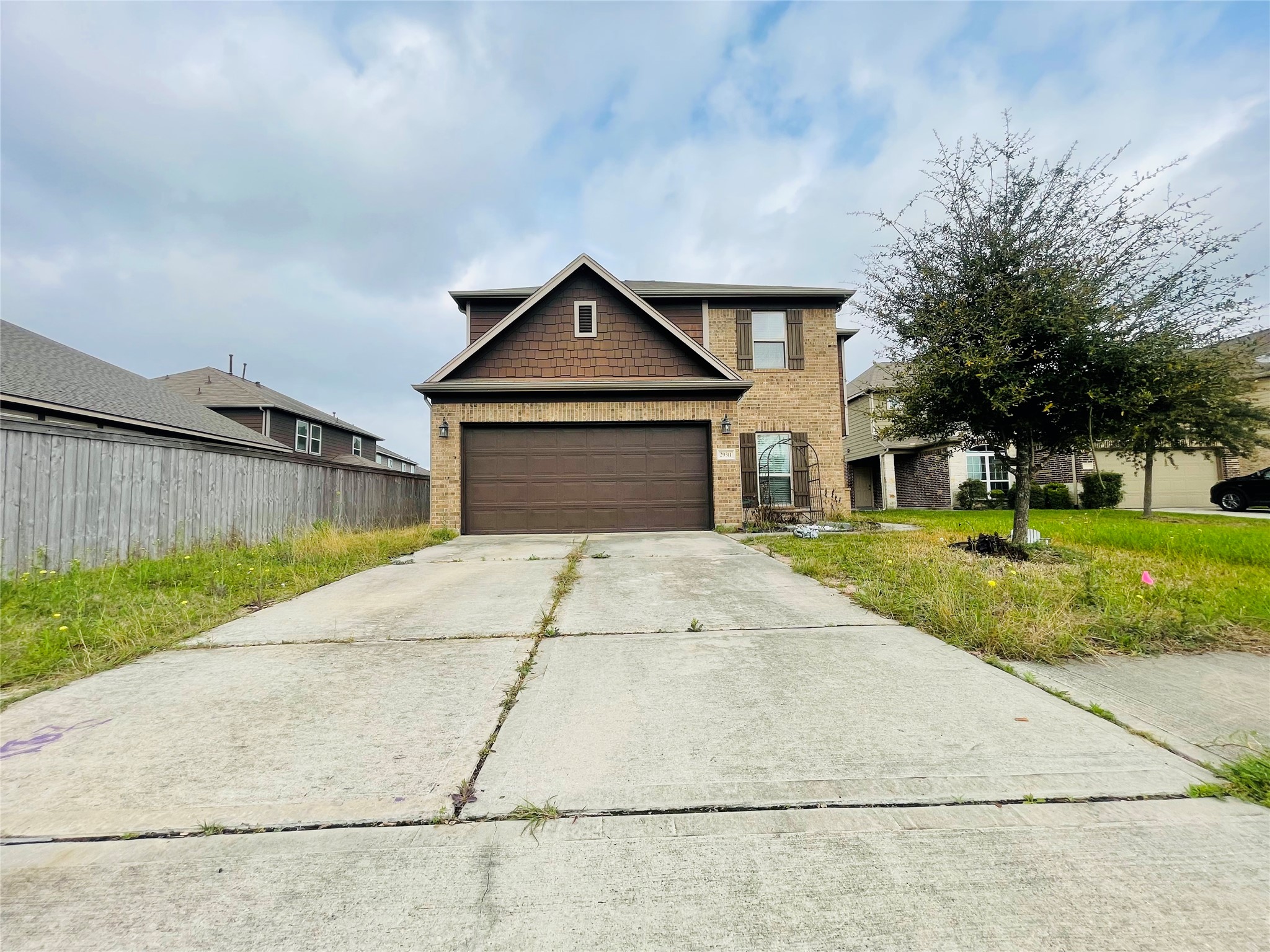 29311 Nectar Bloom Court Spring, TX 77386 - Photo 2 of 15 a front view of a house with a yard and garage
