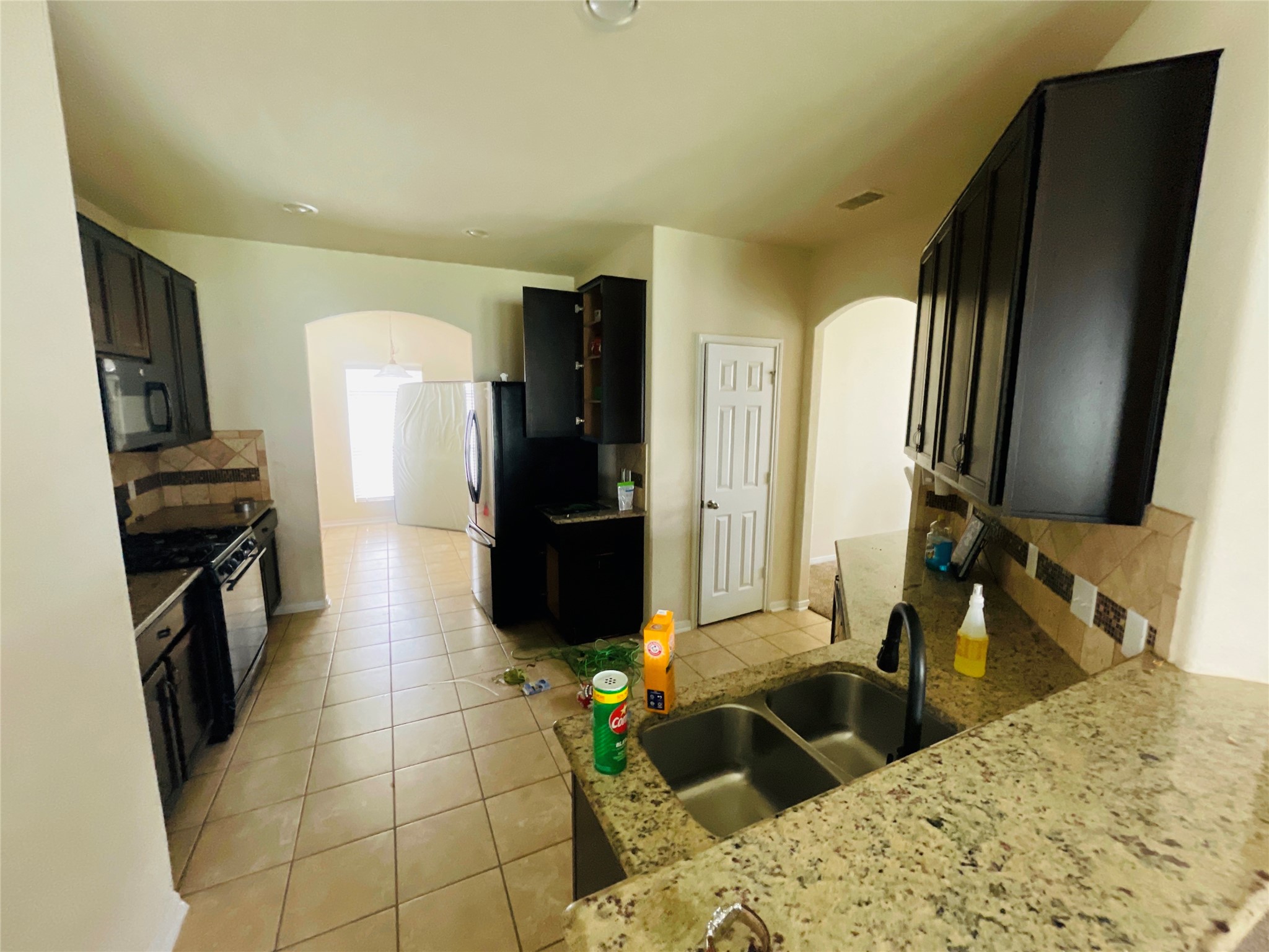 29311 Nectar Bloom Court Spring, TX 77386 - Photo 6 of 15 a kitchen with a refrigerator and a sink