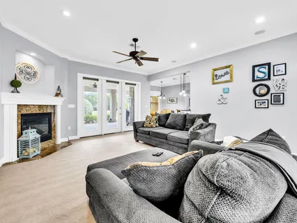 a large kitchen with stainless steel appliances granite countertop a refrigerator a sink and dishwasher