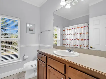 a view of a backyard with table and chairs under an umbrella