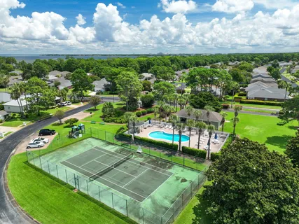 a front view of a house with a garden and yard
