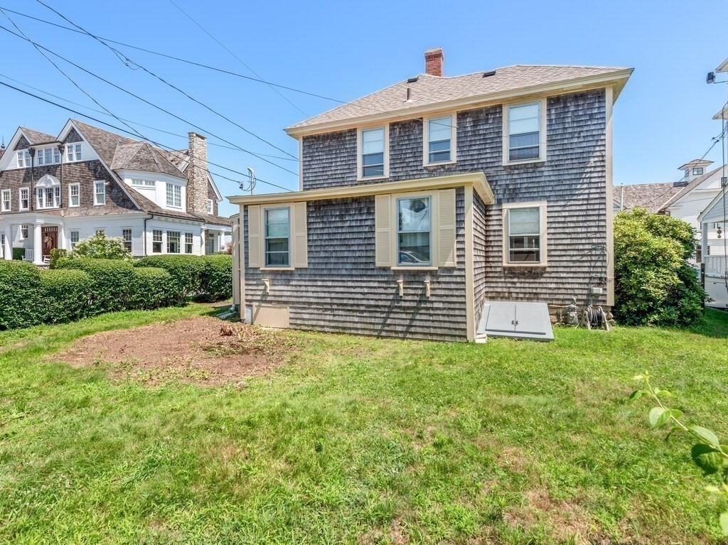 2 Collier Road Scituate, MA 02066 - Photo 14 of 41 a front view of a house with a garden