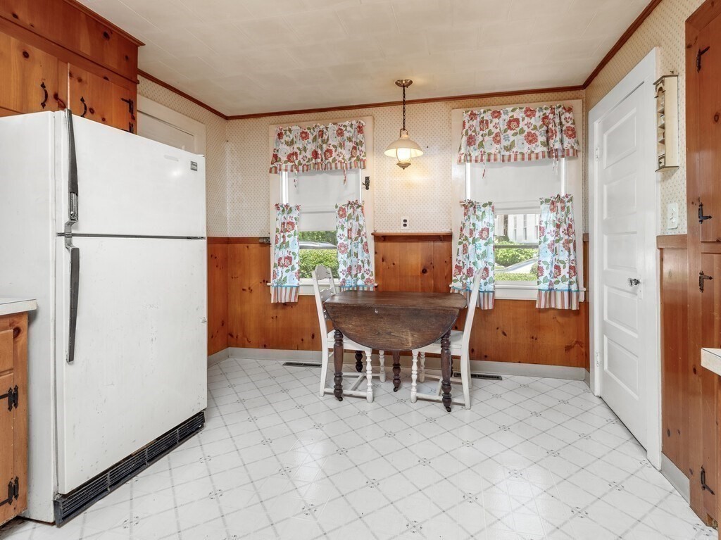 2 Collier Road Scituate, MA 02066 - Photo 18 of 41 a kitchen with stainless steel appliances a refrigerator a table and chairs