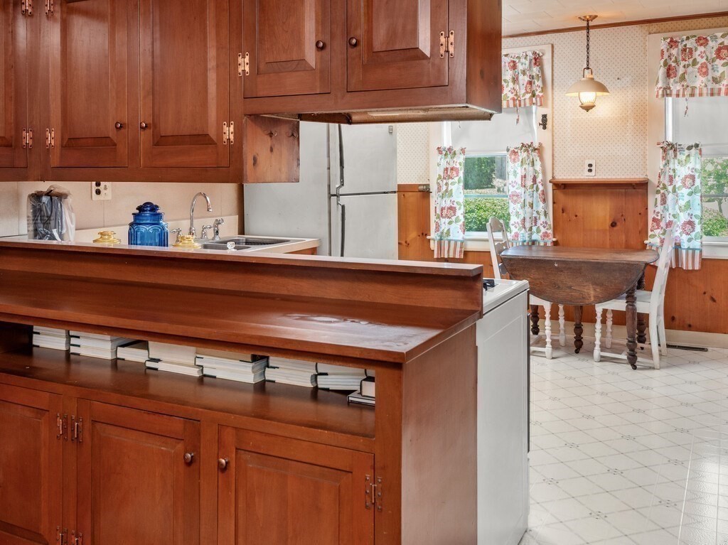 2 Collier Road Scituate, MA 02066 - Photo 19 of 41 a kitchen with stainless steel appliances granite countertop a sink and cabinets