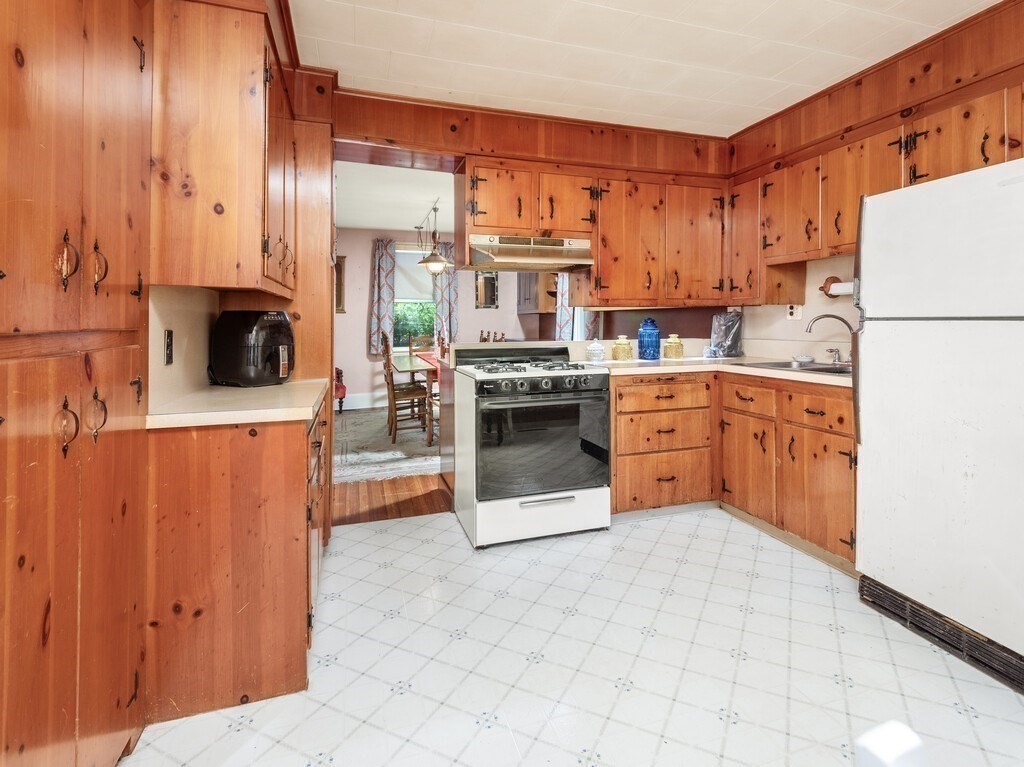 2 Collier Road Scituate, MA 02066 - Photo 20 of 41 a kitchen with stainless steel appliances a stove top oven a refrigerator and a oven