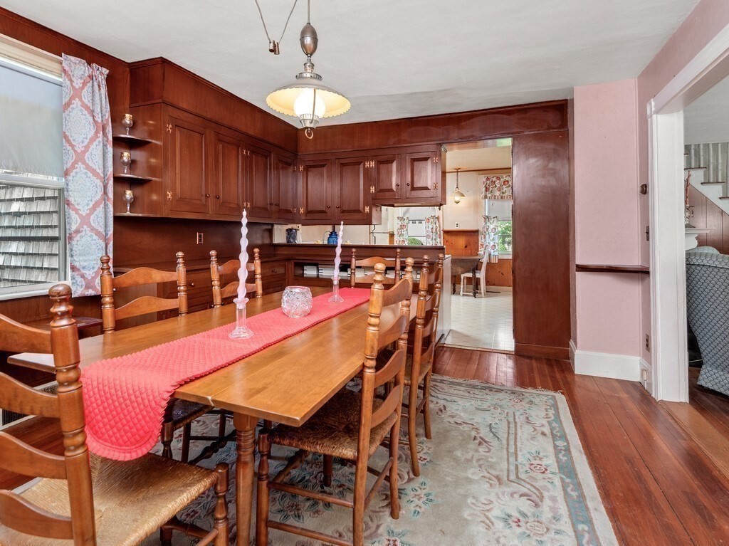 2 Collier Road Scituate, MA 02066 - Photo 22 of 41 a dining room with a wooden table and chairs