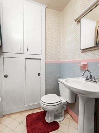 2 Collier Road Scituate, MA 02066 - Photo 24 of 41 a bathroom with a toilet a sink and mirror