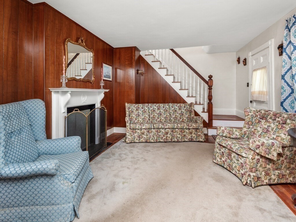 2 Collier Road Scituate, MA 02066 - Photo 25 of 41 a living room with furniture and a fireplace