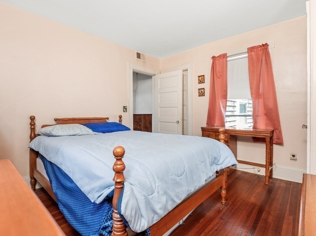 2 Collier Road Scituate, MA 02066 - Photo 32 of 41 a bedroom with a bed and a large window