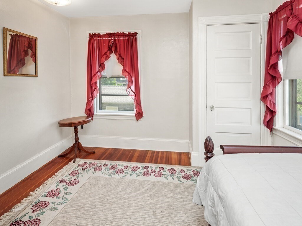 2 Collier Road Scituate, MA 02066 - Photo 33 of 41 a bedroom with a bed and a window