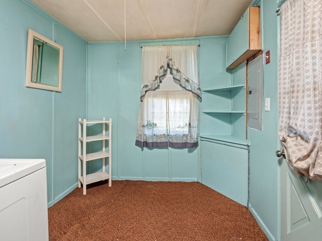 2 Collier Road Scituate, MA 02066 - Photo 35 of 41 a view of a livingroom with an empty space and a window