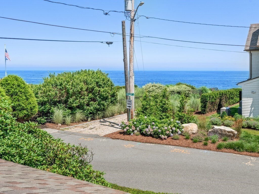 2 Collier Road Scituate, MA 02066 - Photo 36 of 41 a sidewalk with a sign board