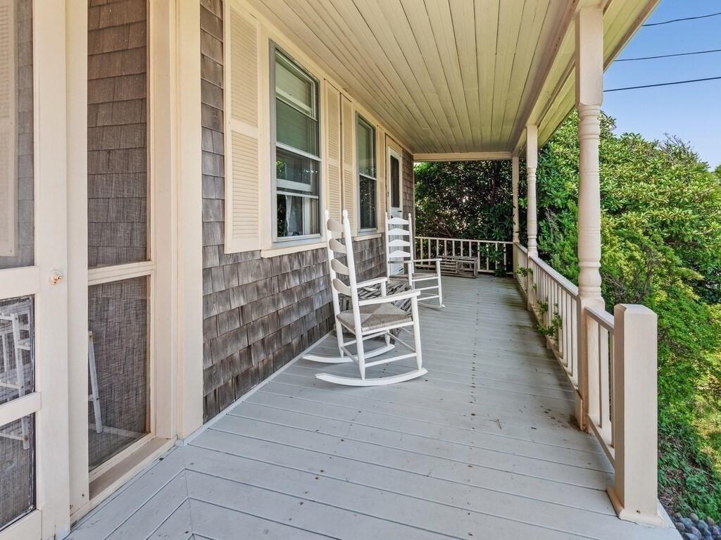 2 Collier Road Scituate, MA 02066 - Photo 6 of 41 a chairs and table in a balcony next to a yard