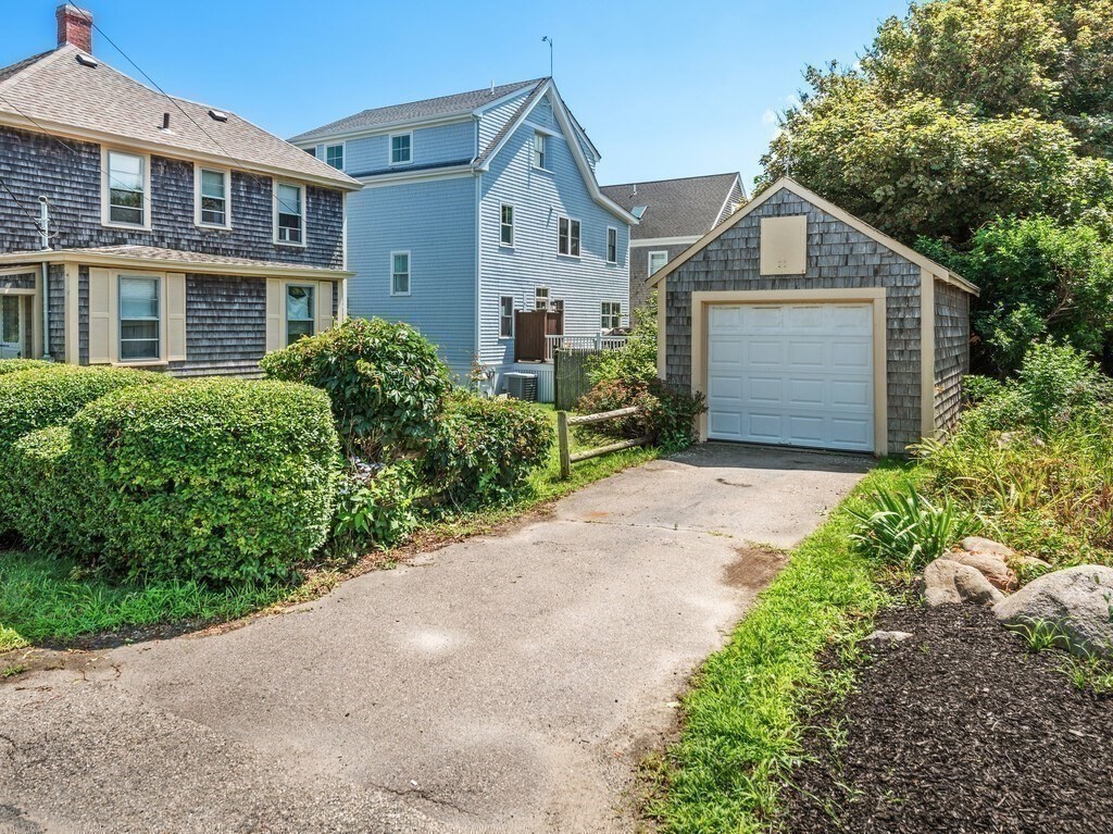 2 Collier Road Scituate, MA 02066 - Photo 9 of 41 a front view of a house with a garden