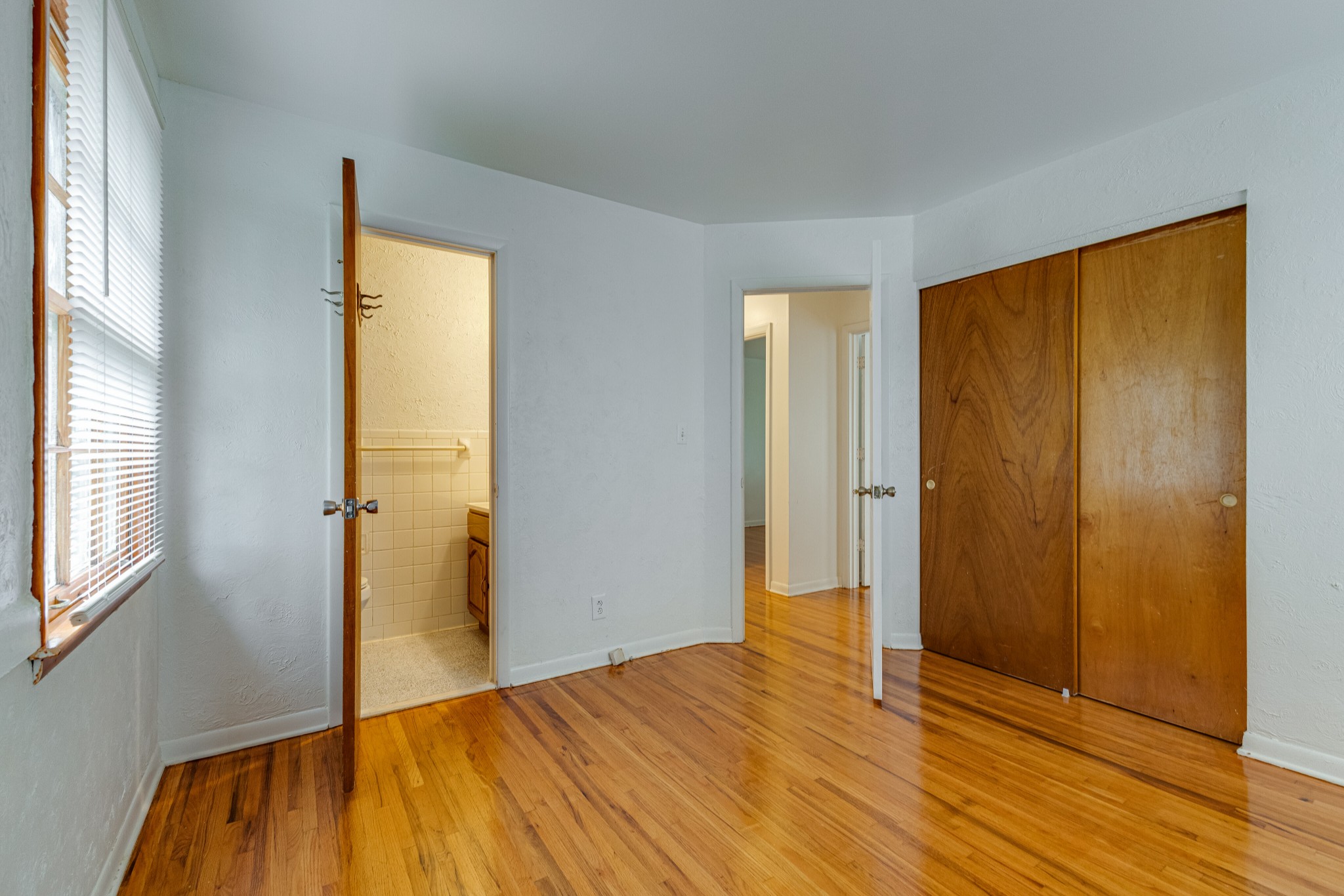 76 Tusculum Road Antioch, TN 37013 - Photo 11 of 33 a view of an empty room with wooden floor and a window