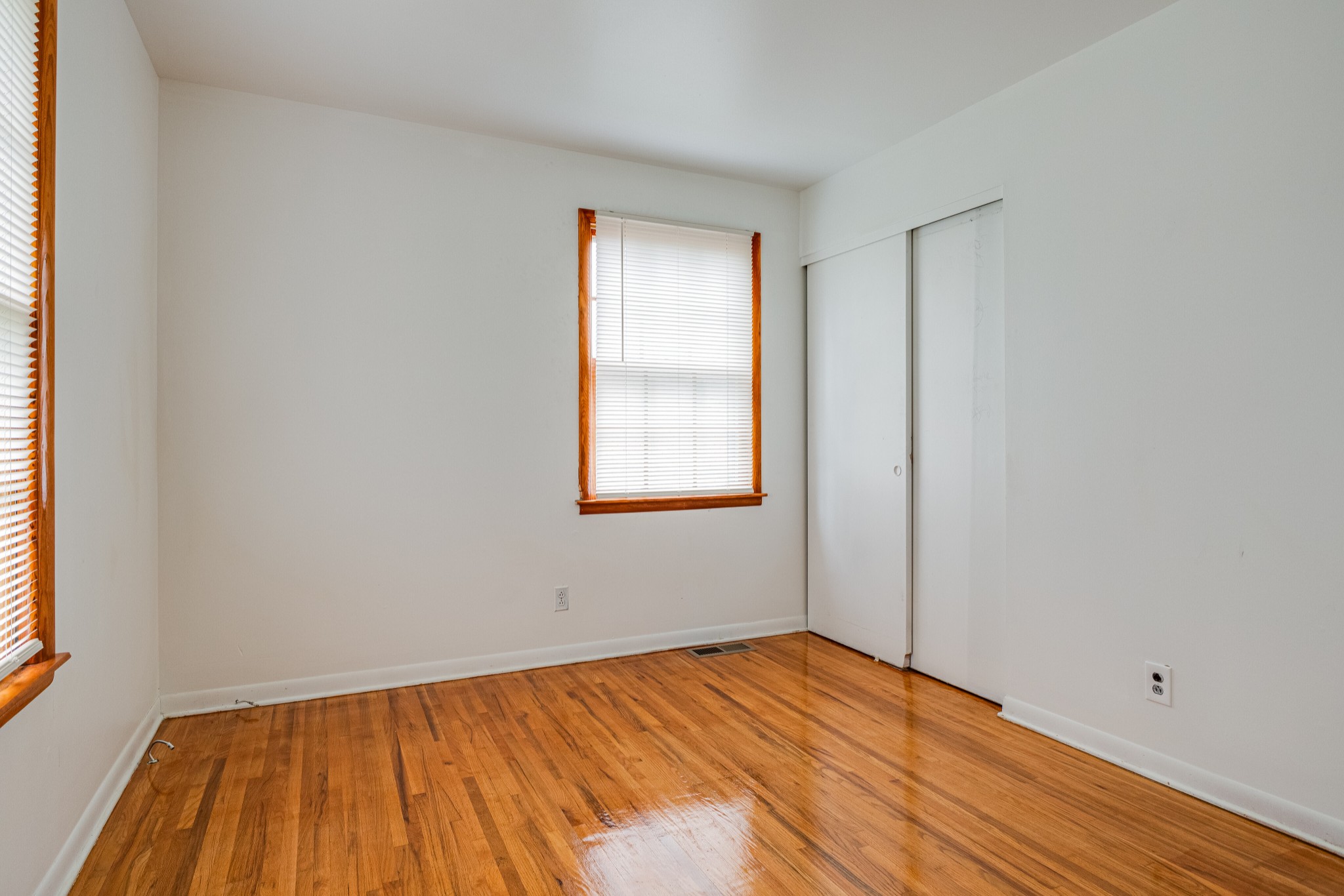 76 Tusculum Road Antioch, TN 37013 - Photo 13 of 33 an empty room with wooden floor and windows