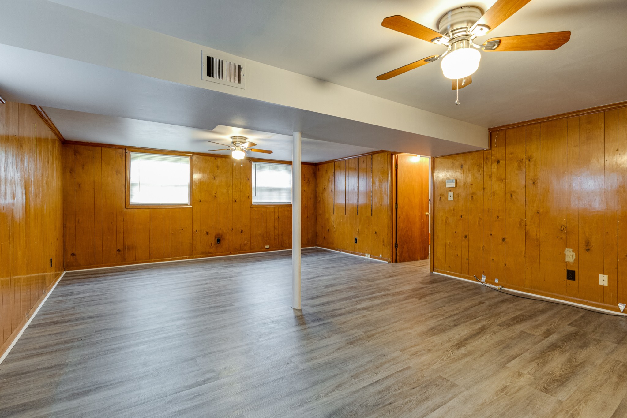 76 Tusculum Road Antioch, TN 37013 - Photo 20 of 33 a view of an empty room with window and wooden floor