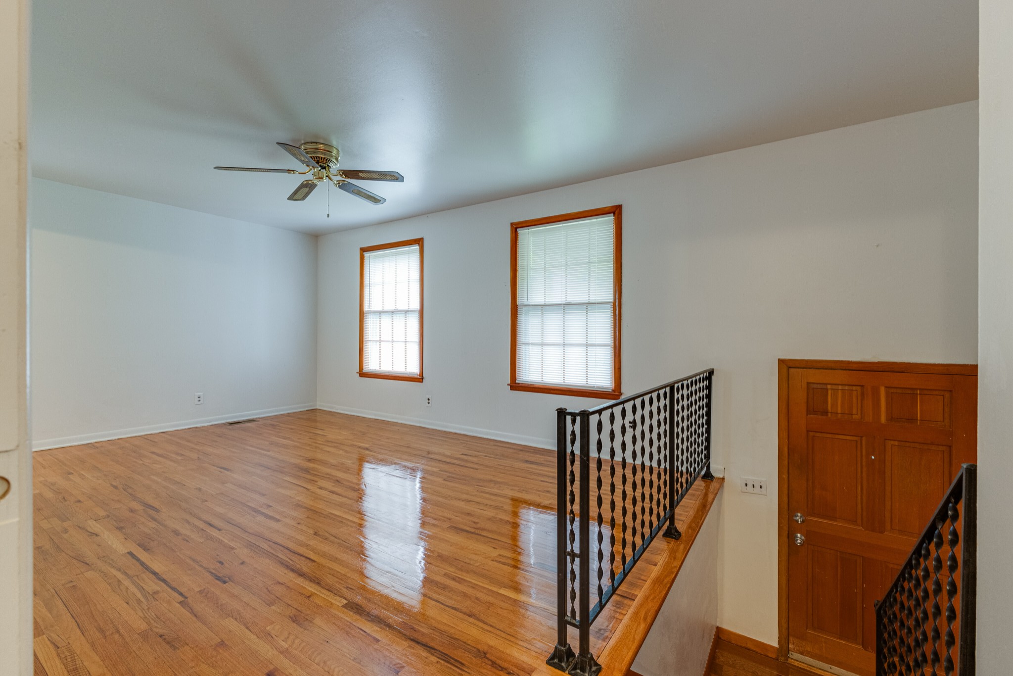76 Tusculum Road Antioch, TN 37013 - Photo 6 of 33 a view of an empty room with wooden floor and a window