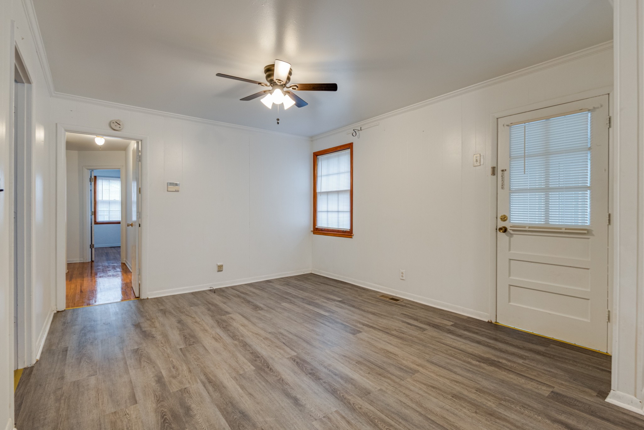76 Tusculum Road Antioch, TN 37013 - Photo 8 of 33 wooden floor in an empty room with a window