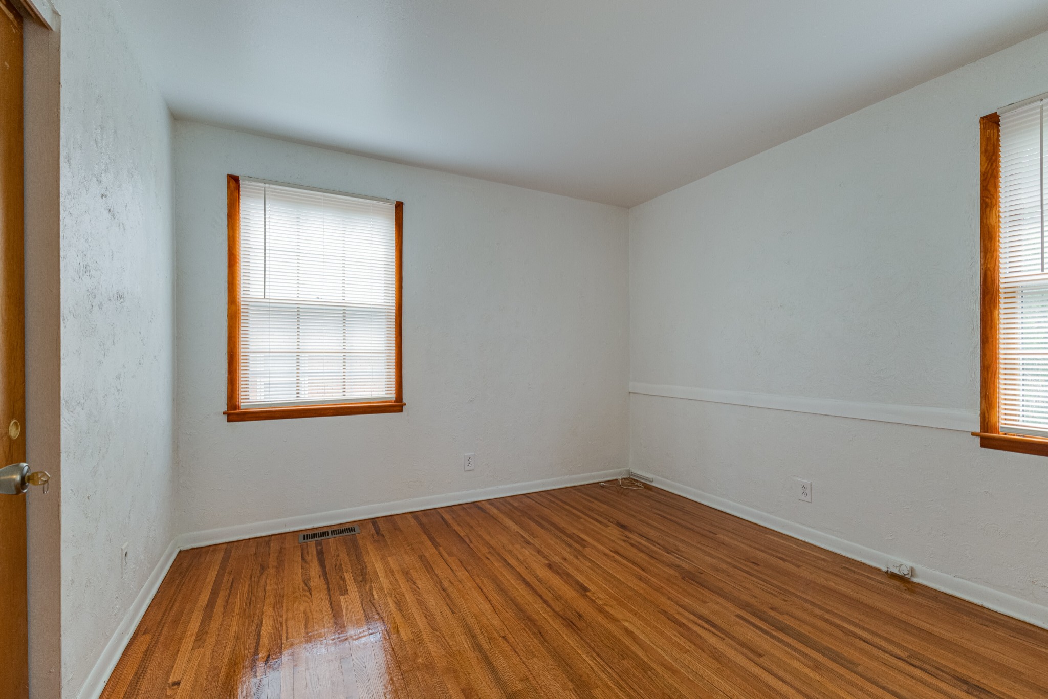 76 Tusculum Road Antioch, TN 37013 - Photo 10 of 33 an empty room with a window and wooden floor
