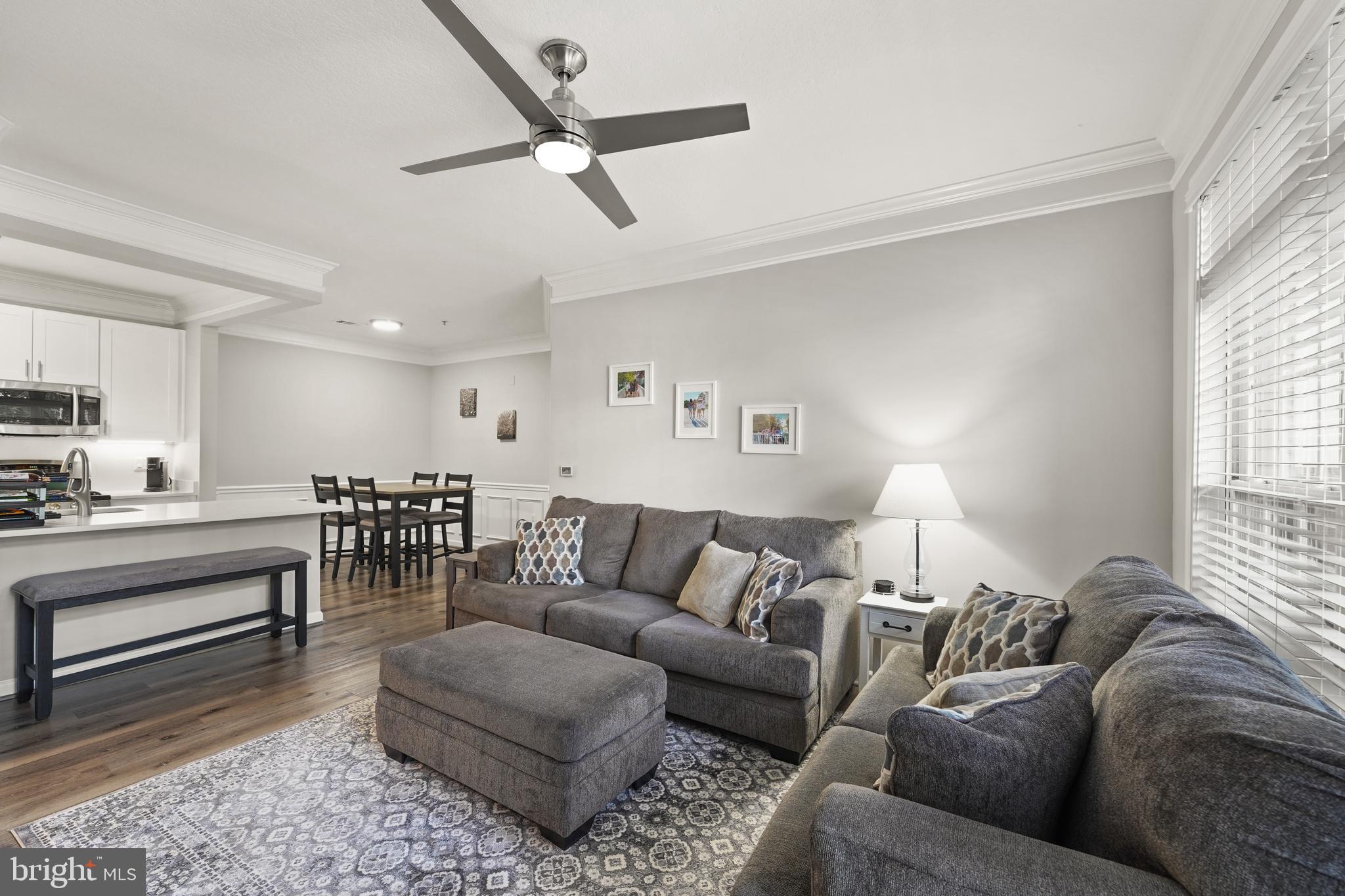 502 Sunset View Terrace Southeast, Unit 107 Leesburg, VA 20175 - Photo 13 of 50 a living room with furniture and a wooden floor