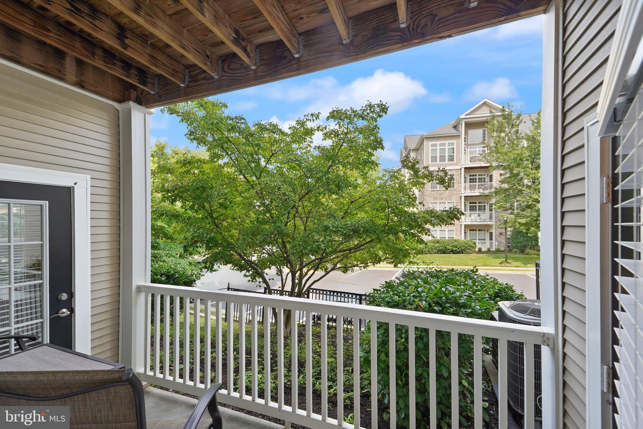 502 Sunset View Terrace Southeast, Unit 107 Leesburg, VA 20175 - Photo 14 of 50 a view of a balcony with a flower plants