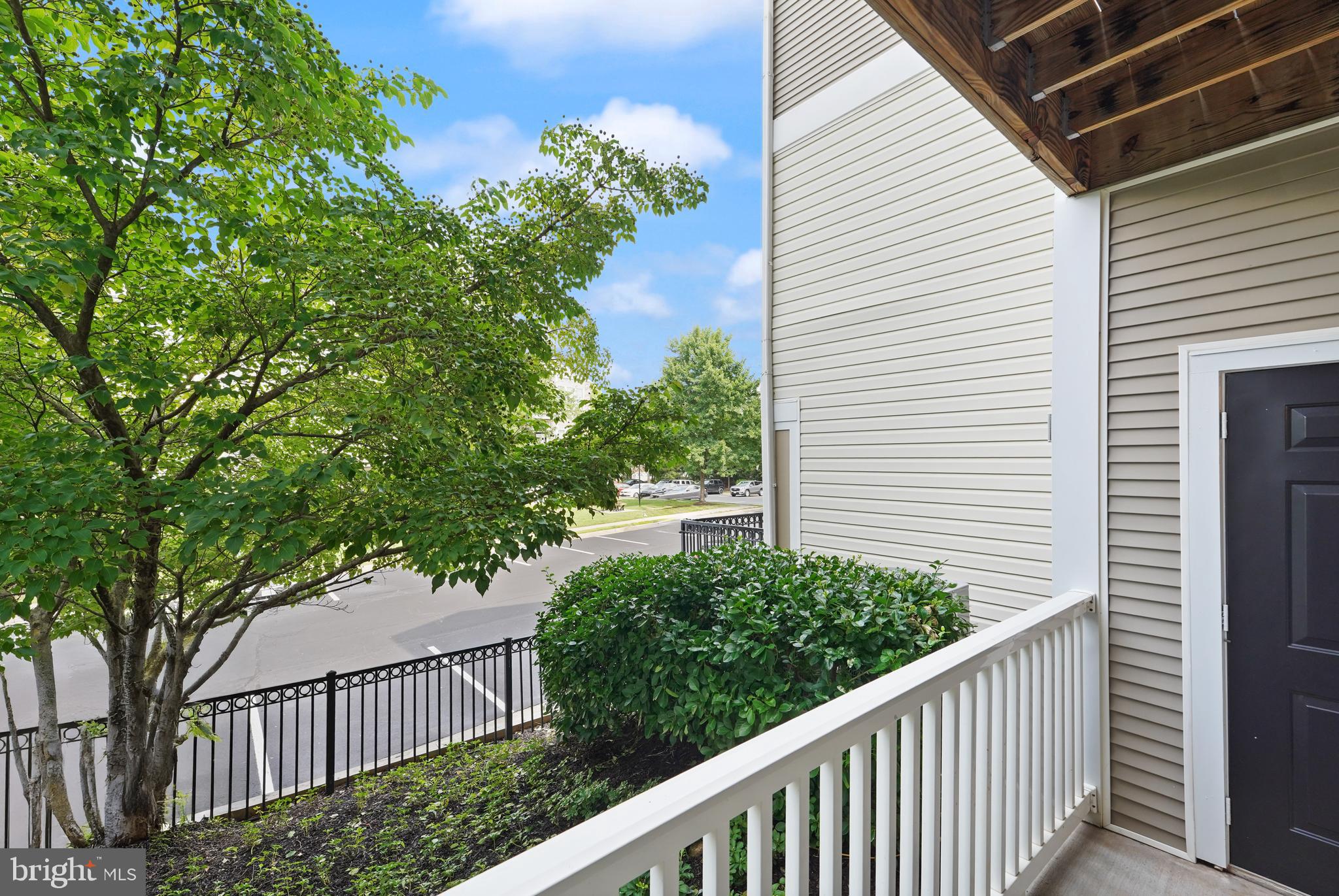 502 Sunset View Terrace Southeast, Unit 107 Leesburg, VA 20175 - Photo 16 of 50 a balcony with an outdoor space