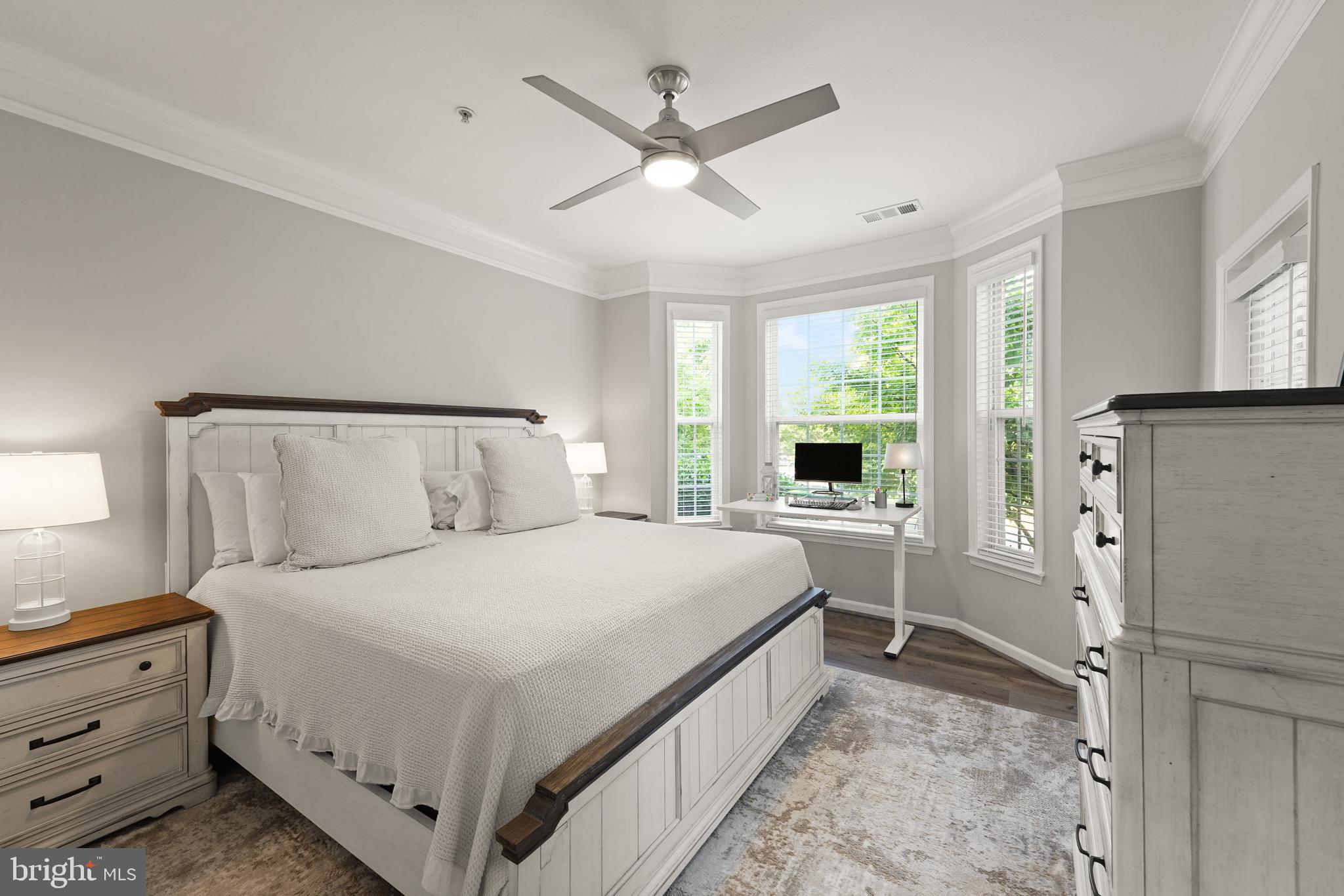 502 Sunset View Terrace Southeast, Unit 107 Leesburg, VA 20175 - Photo 26 of 50 a bedroom with a large bed and a window