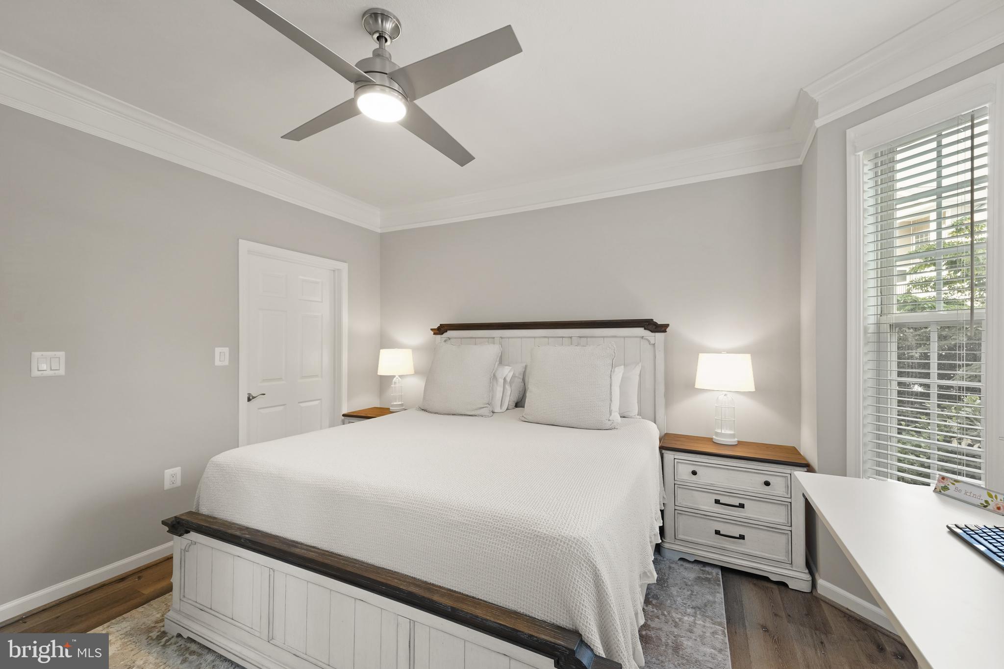 502 Sunset View Terrace Southeast, Unit 107 Leesburg, VA 20175 - Photo 27 of 50 a bedroom with a bed and a window
