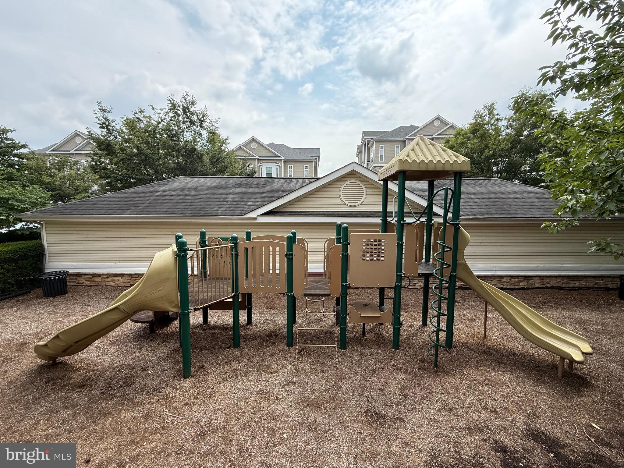 502 Sunset View Terrace Southeast, Unit 107 Leesburg, VA 20175 - Photo 38 of 50 a view of a house with backyard and sitting area