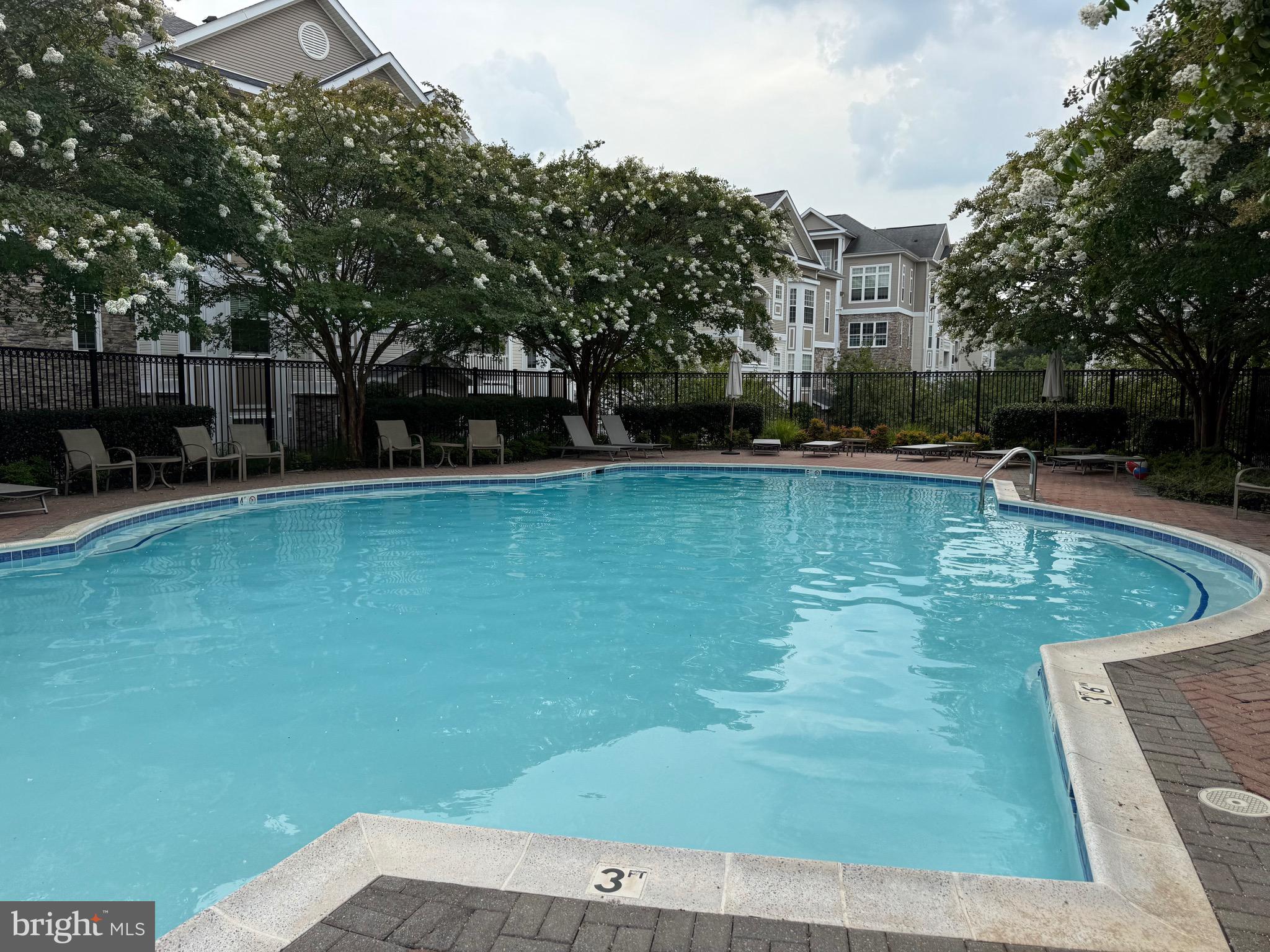 502 Sunset View Terrace Southeast, Unit 107 Leesburg, VA 20175 - Photo 42 of 50 a view of a swimming pool with a patio