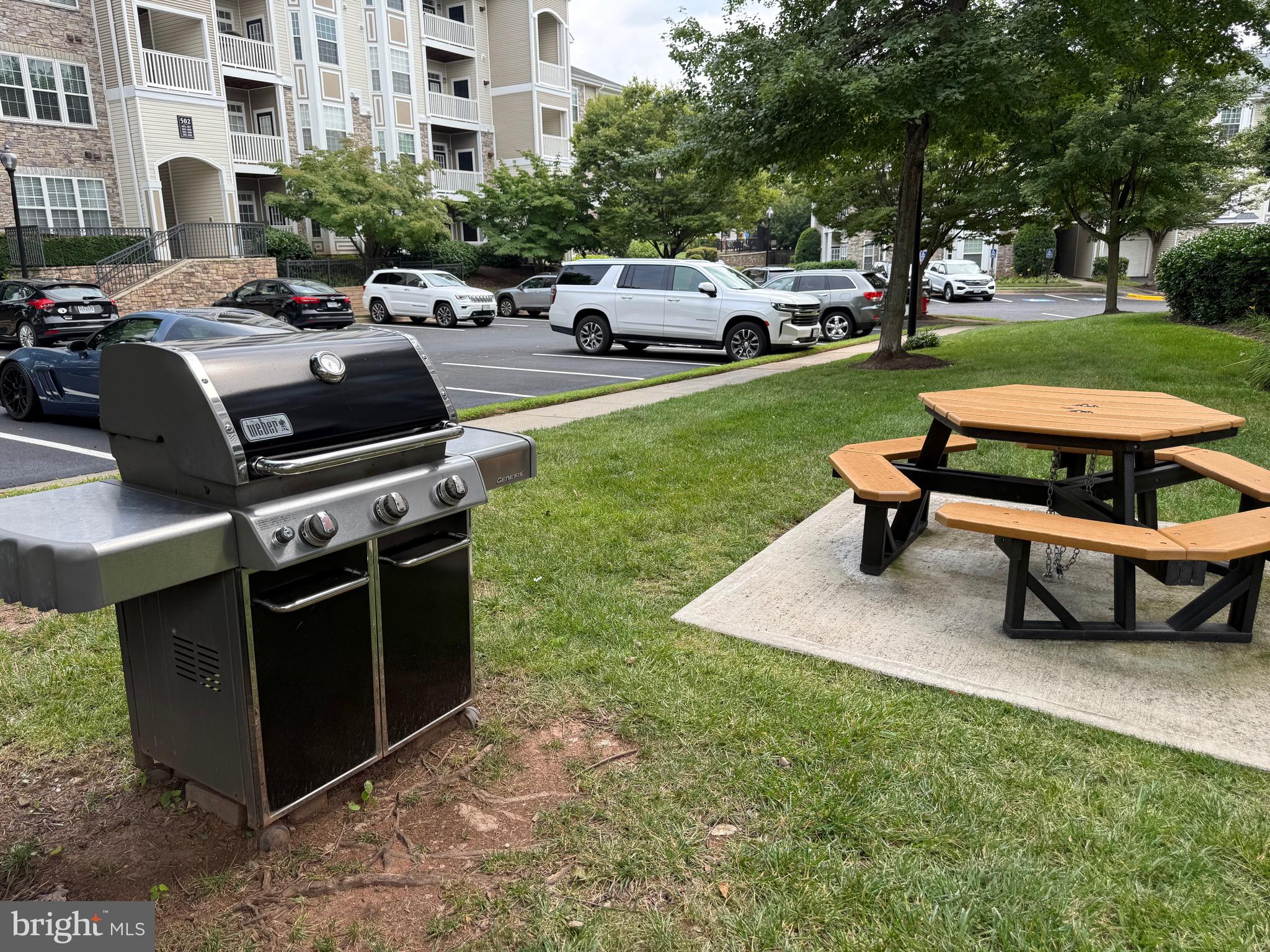 502 Sunset View Terrace Southeast, Unit 107 Leesburg, VA 20175 - Photo 44 of 50 a park bench sitting in the middle of a park