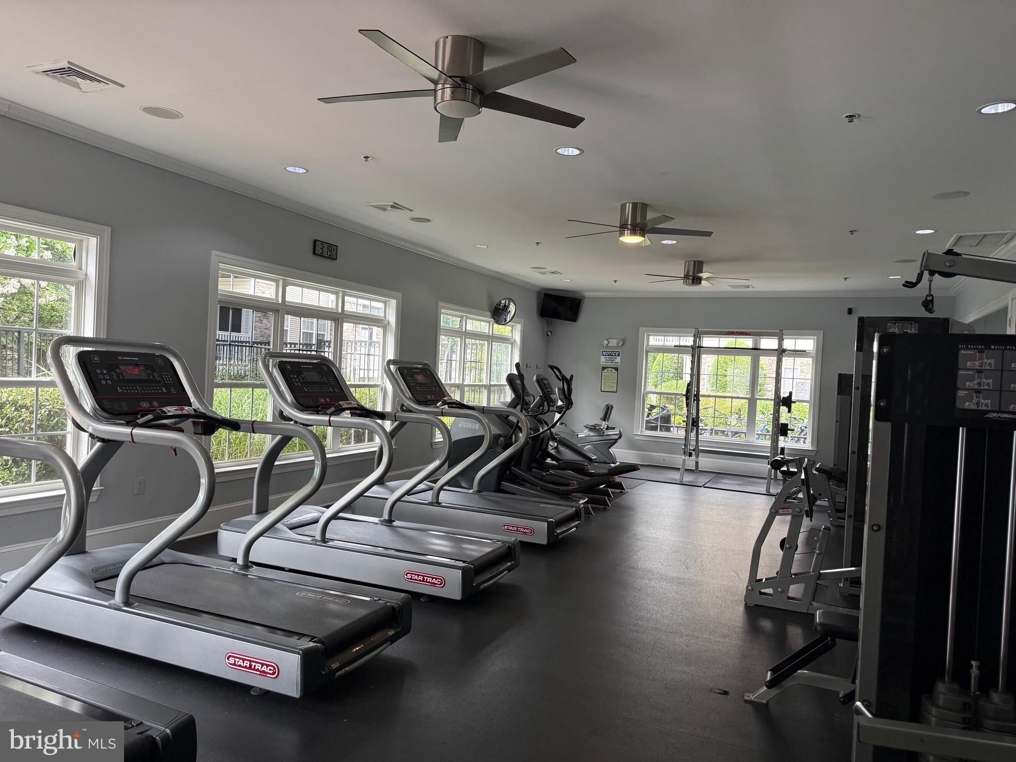 502 Sunset View Terrace Southeast, Unit 107 Leesburg, VA 20175 - Photo 46 of 50 a room with gym equipment and windows