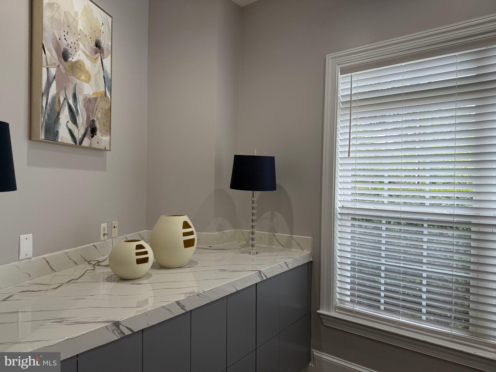 502 Sunset View Terrace Southeast, Unit 107 Leesburg, VA 20175 - Photo 48 of 50 a bathroom with a sink and a mirror