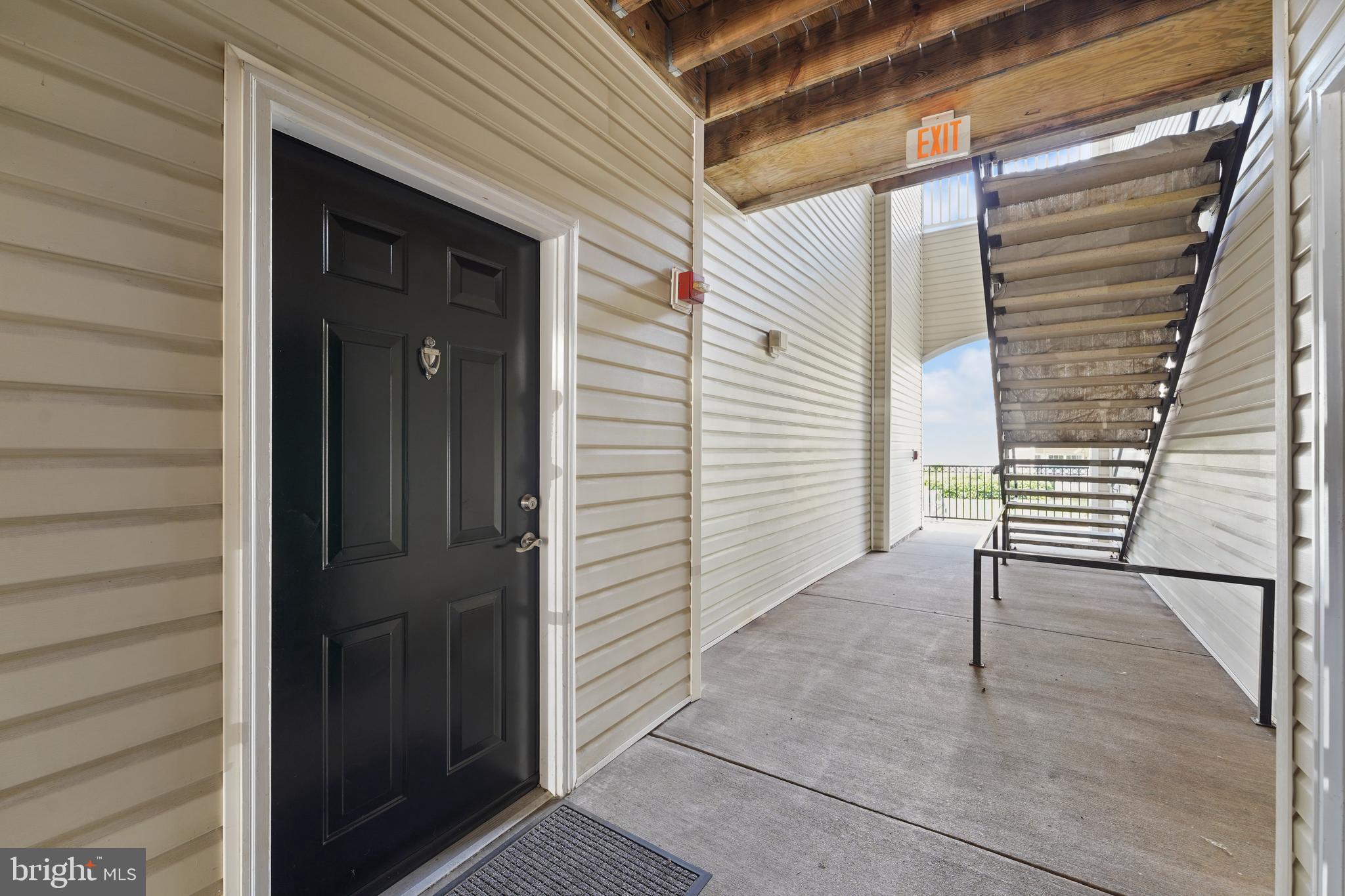 502 Sunset View Terrace Southeast, Unit 107 Leesburg, VA 20175 - Photo 6 of 50 a view of front door and porch